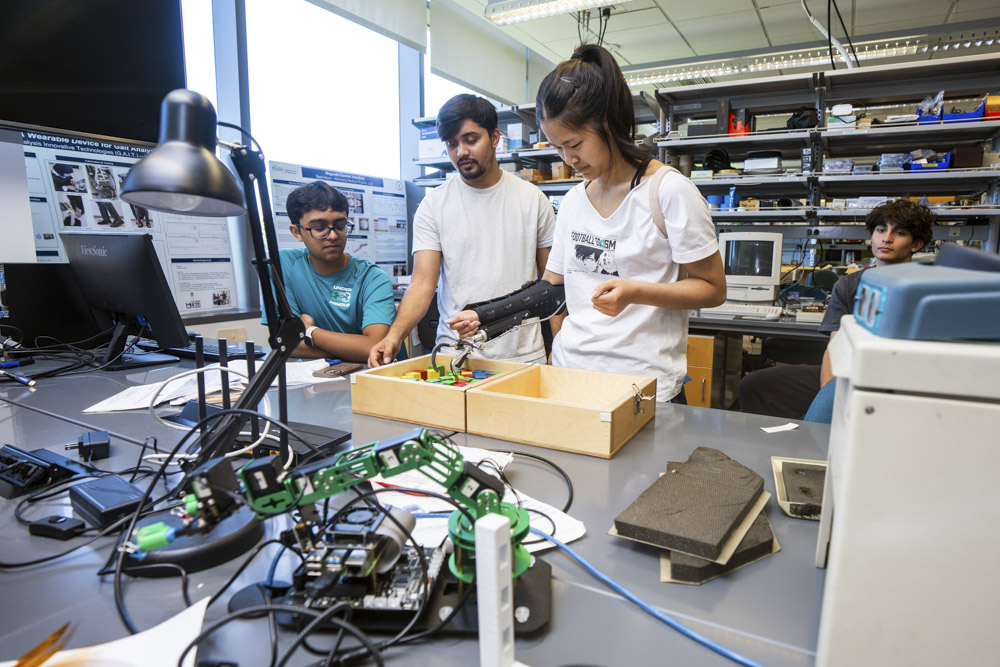 BioE Buzz summer campers learn about bioengineering by testing exoskeletons and biomechanics while interacting with George Mason faculty and students.